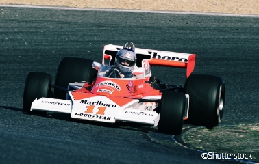 A vintage McLaren race car driven by James Hunt, who won the F1 season championship by just one point in 1976. A scene from a commemorative vintage race car drive.